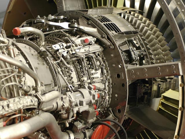Technician performing aero engine testing to ensure safety and reliability. 